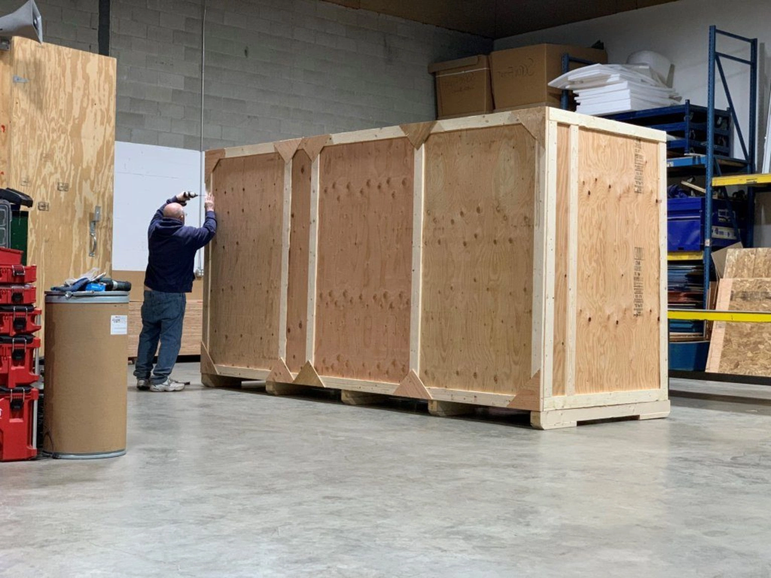 Custom wooden crate preparation for international export Custom wooden export crate being prepared in a workshop